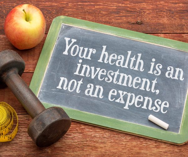 Blackboard sign that states your health is an investment, not an expense